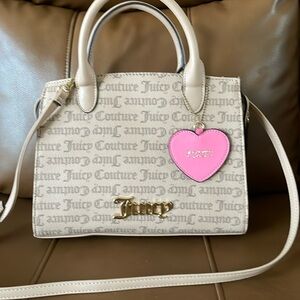 Juicy Coture bag can be used as a crossbody also I used it once like new